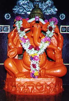 Shree Siddhivinayak Mahaganapati idol at Titwala, decorated with flower garlands